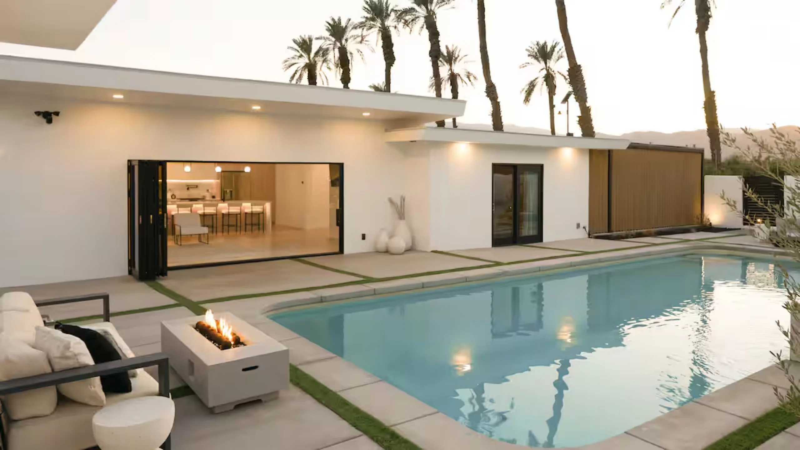 The pool and house at dusk in the original listing photograph, before the relaunch, The Villa Palms, Indio, California